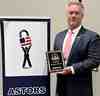 Jeff Fields accepting the ASTOR award on behalf of Gallagher in New York last month.